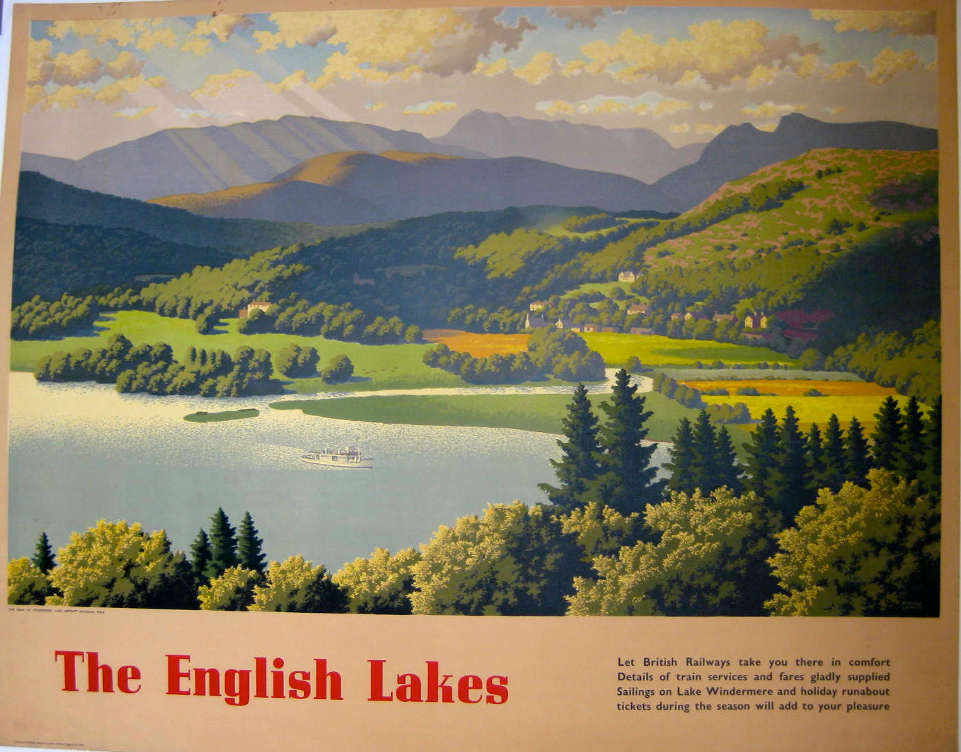 An aerial scene of a lake and mountains